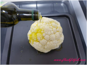 pour the olive oil all over the cauliflower