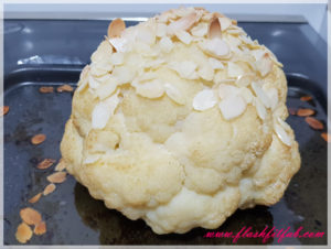 Enjoy your yummy whole roasted cauliflower with almond nuts